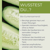 Grafik mit aufgeschnittener Gurke und Text über die Vorteile von palmölfreiem Bio-Gurkensamenöl für die Haut: beruhigend, feuchtigkeitsspendend, stärkt die Hautbarriere, verfeinert das Hautbild, ideal bei empfindlicher oder unreiner Haut.