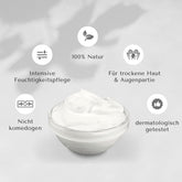 palmölfreie Naturkosmetik-Creme in Glasschale, umgeben von Icons: 100 % Natur, intensive Feuchtigkeitspflege, für trockene Haut & Augenpartie, nicht komedogen, dermatologisch getestet